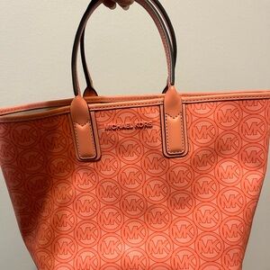 Mid-sized pink/peach Michael Kors tote